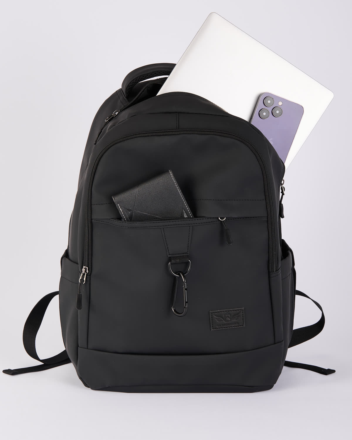 The bag packed with a laptop, wallet and phone