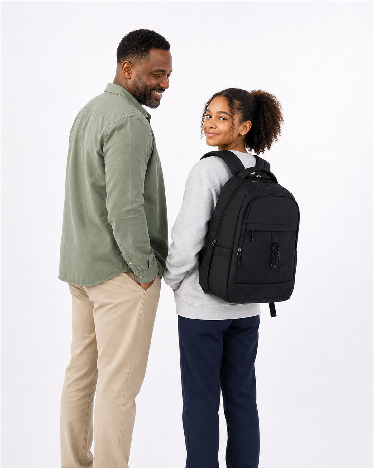 A parent and student standing together, the student wearing the GA Backpack